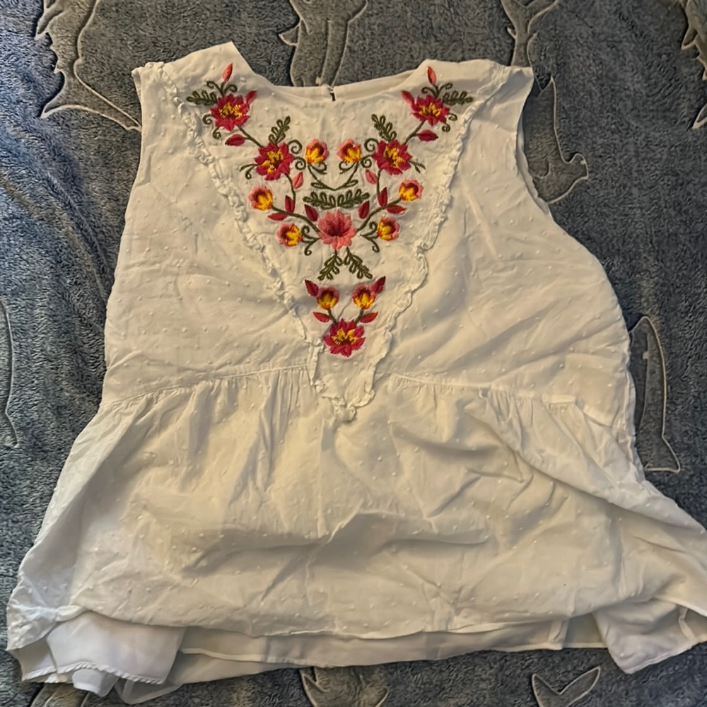 Floral embroidery with a white linen fabric